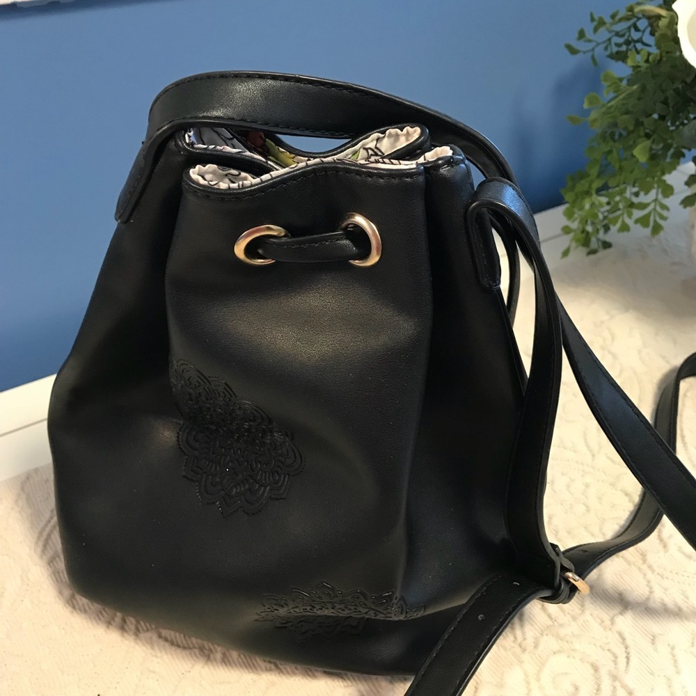 Desigual bucket handbag with unique designs.